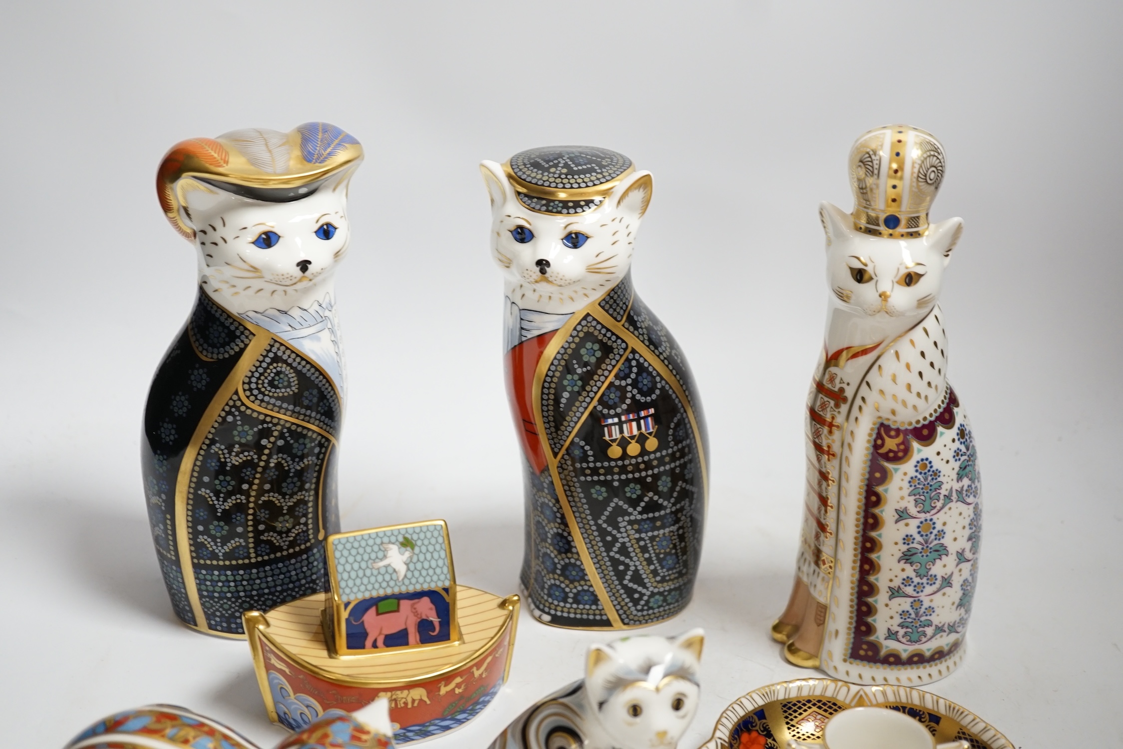 A collection of Royal Crown Derby porcelain and paperweights including Pearly Queen, Pearly King, Russian, etc.